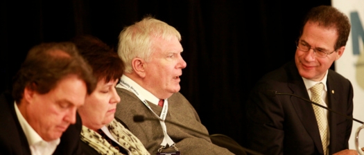 John Walsh sits next to other panels members at a past NDS event.